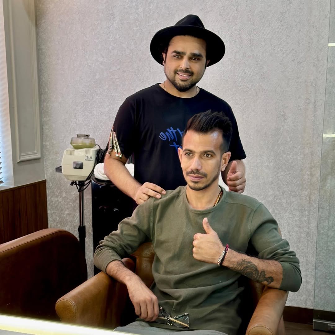Senior artist cutting hair